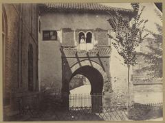 Historic photograph of the Alhambra gate in Granada, Spain