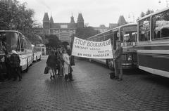 Anti chalk demonstrations with protesters holding banners and buses departing from Museumplein in Amsterdam