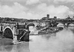 Ruined bridge over the Tiber River with old buildings in the background