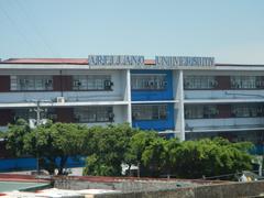 Arellano University main building with lawn and trees