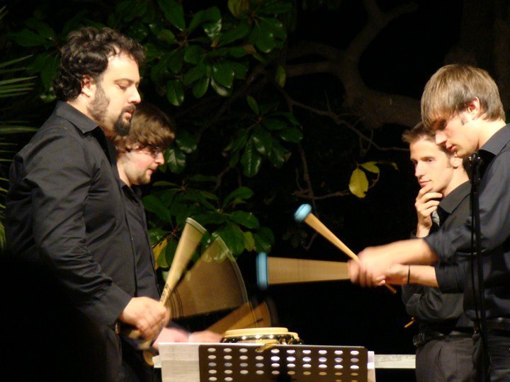 Performance of Drumming by Steve Reich with musicians playing percussion instruments