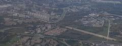Aerial view of former Kraków-Czyżyny airport in 2020 showing old airport buildings and surrounding urban area