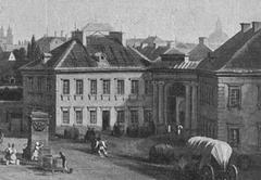 Historic street scene in Old Warsaw with classic buildings and people walking