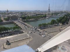 Grande Roue de Paris Ferris wheel with Palais Bourbon and Eiffel Tower in the background, Paris, France