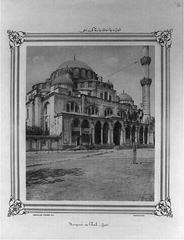 Exterior view of Şehzade Mosque with domes and minarets under cloudy sky