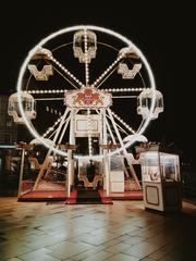 Illuminated Ferris wheel at night in Jungfernstieg, Hamburg