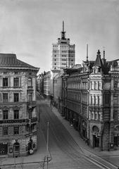 Street view of Kalevankatu buildings 1, 3, and 5 with Hotel Torni in the background in black and white