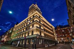 Hotel Torni Helsinki at night with illuminated facade