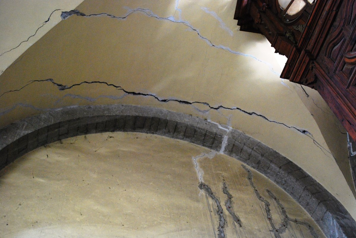 Damage to upper corner near entrance of La Santisima Church in Mexico City due to sinking into soft soil