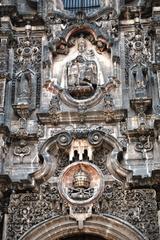 Sculpted image of the Trinity in the main portal of La Santisima Church Mexico City