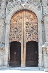 Ornate wooden doors of the main portal of La Santisima Church in Mexico City