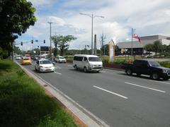 Roxas Boulevard in Malate, Manila showing busy urban street with vehicles and buildings
