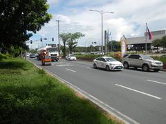 Roxas Boulevard Malate Manila section with traffic and buildings at twilight