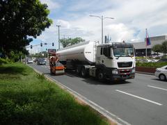 Busy street view of Roxas Boulevard intersection with Mabini Avenue and Pablo Ocampo Street in Malate, Manila during daytime
