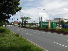 Roxas Boulevard Malate Manila street view with buildings and vehicles at the corner of Harrison Avenue, Mabini Street, Pablo Ocampo Street, and Adriatico Street