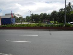 Roxas Boulevard intersection with Mabini Street and Adriatico Street in Malate, Manila showing city street signs and buildings