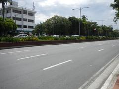 Roxas Boulevard in Malate, Manila with traffic and tall buildings including Bangko Sentral ng Pilipinas
