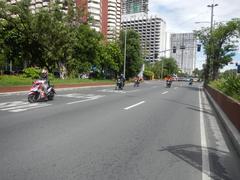 Roxas Boulevard at Malate, Manila with traffic and buildings along the street