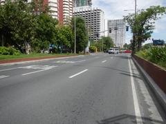 Roxas Boulevard intersection in Malate Manila with traffic and pedestrian activity