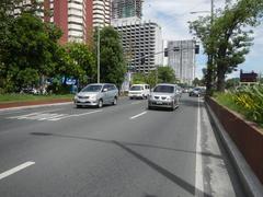 Roxas Boulevard section in Malate, Manila showing busy streets with cars and buildings including landmarks like Bangko Sentral ng Pilipinas and Metropolitan Museum of Manila