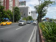 Roxas Boulevard in Malate, Manila with traffic and urban buildings including Bangko Sentral ng Pilipinas and Metropolitan Museum of Manila