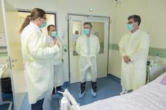 Doctor speaking with elderly patient at hematology department in UKC Ljubljana hospital