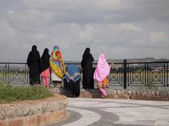View of Rawal Lake with lush greenery and a clear sky in Islamabad