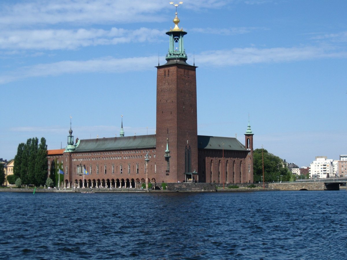 Stockholm City Hall by the water with blue sky