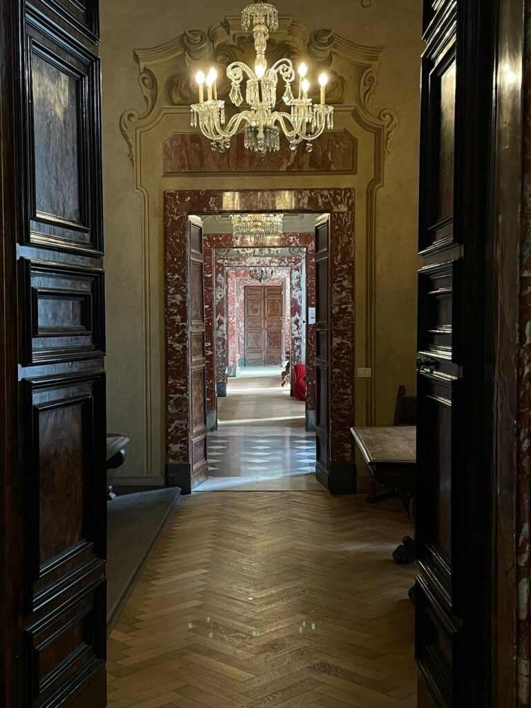 Interior corridor with a series of connected rooms in Palazzo Serra di Cassano, Naples