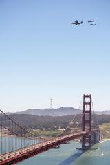 U.S. Air National Guard HC-130J Combat King II aircraft and two HH-60G Pave Hawk helicopters flying over San Francisco Bay Area on Memorial Day 2020