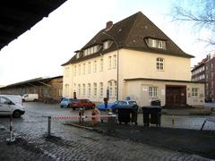Railway goods service building in Altona, Germany with train tracks and freight car