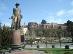 Monument to David Sarajishvili in Rike neighborhood, Tbilisi with Palace of Queen Darejan in the background