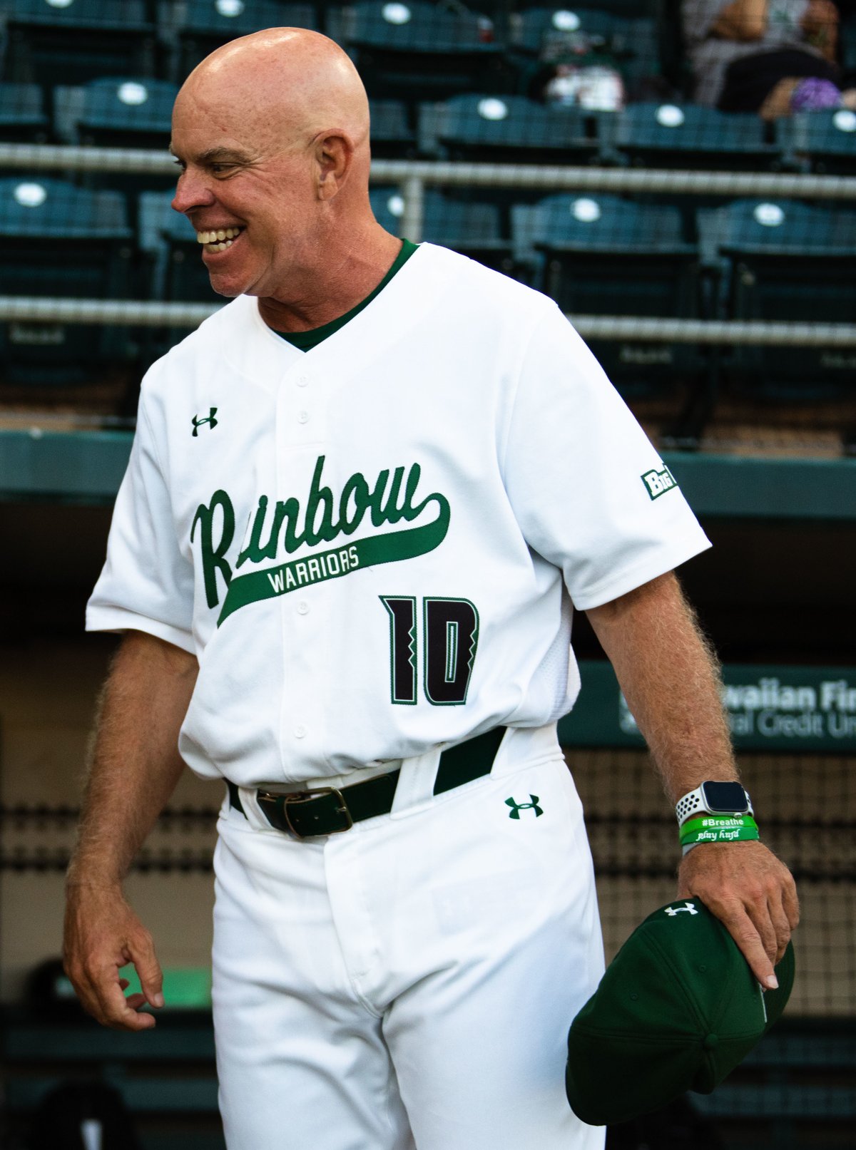 U.S. Marine Corps Col. Speros Koumparakis talking to Rich Hill, baseball coach, at University of Hawaii baseball game