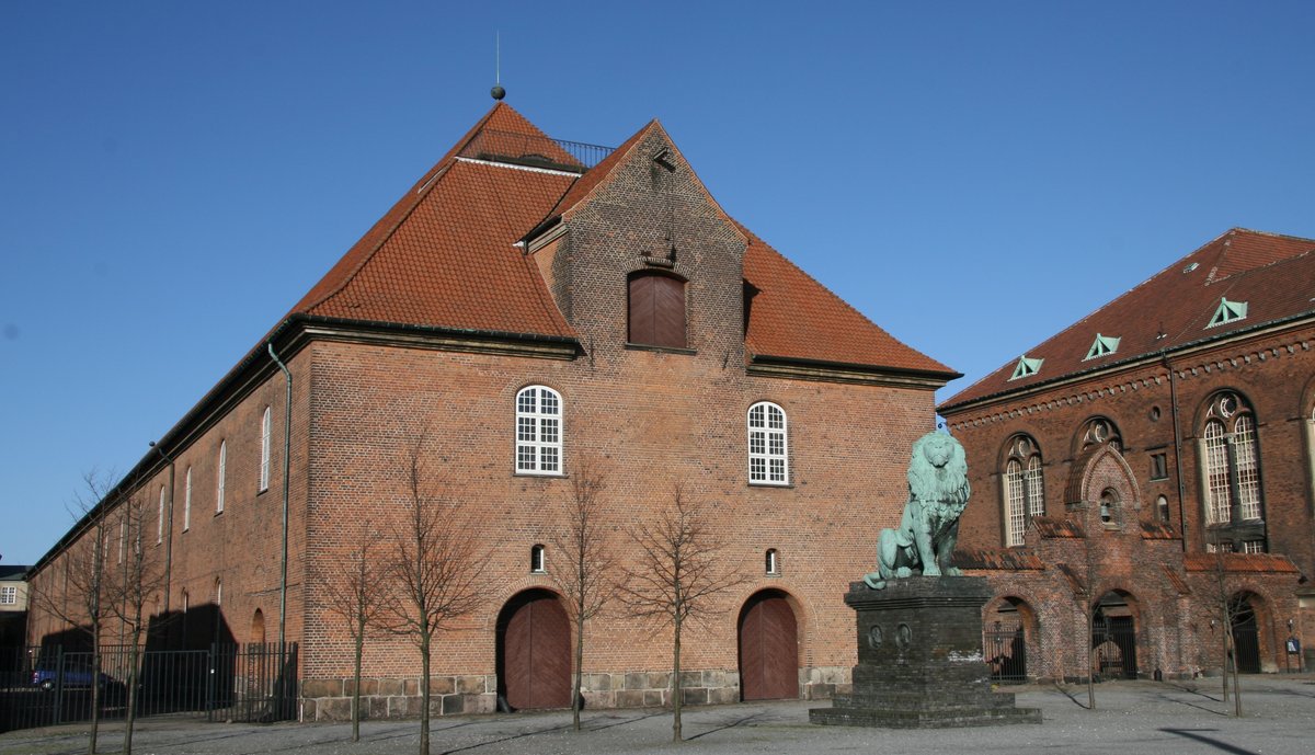 Rear view of Tøjhusmuseet The Royal Danish Arsenal Museum building in Copenhagen with brick facade and arched windows