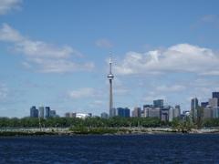 View of Leslie Street Spit with water and greenery under clear blue sky
