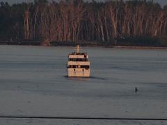 Excursion vessel navigating through the Eastern Gap at dusk