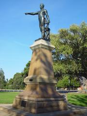Statue of William Light, founder of Adelaide in 1836, holding a telescope on a pedestal