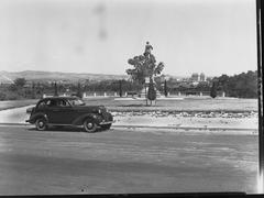 View from Montefiore Hill overlooking the city with statue of Colonel Light and automobile in foreground
