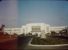 Kodachrome photograph of Limatambo Airport showing vintage aircraft and terminal building