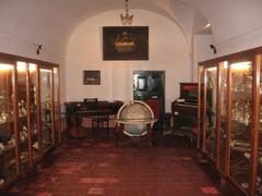 Room inside Convento San Carlos with traditional architecture and vibrant orange walls