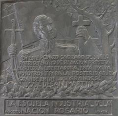 José de San Martín tribute plaque at Convento San Carlos showing him holding a cross and curved saber