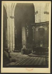 Church interior with ornate choir pillar and episcopal seat at Cathédrale Saint-André de Bordeaux
