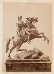 Metal sculpture of a rider on horseback, member of the Persico family