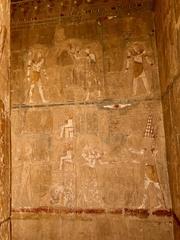 Mortuary Temple of Queen Hatshepsut in Luxor featuring ancient Egyptian classical-style architecture with colonnades and sandstone structure