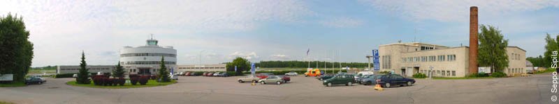 Aerial panorama view of Helsinki-Malmi Airport with runways, terminals and surrounding green landscape