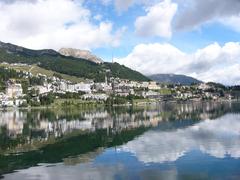 Scenic view of St. Moritz Lake with mountains in the background