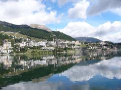 Scenic view of Lake St. Moritz surrounded by mountains in St. Moritz, Switzerland