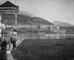 Scenic view of the Swiss Alps with a quaint village and lush greenery under a clear sky