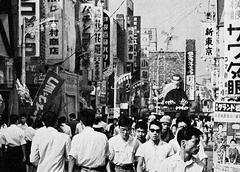 Kabukicho district in Tokyo around 1960 with vintage buildings and street signs