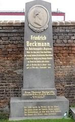 Friedrich Beckmann grave site with tombstone and flowers outdoors